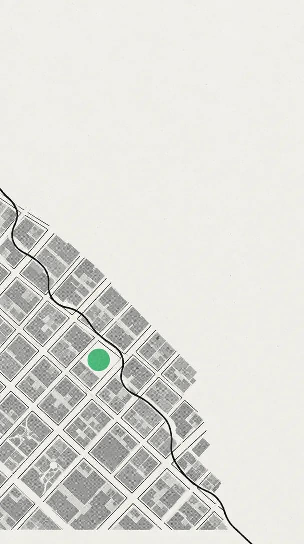 Screenprint illustration of a city street grid seen straight down like a map, grey blocks filling the lower left, one black wire winding through the grid and one block marked with a flat green circle, the rest of the sheet empty